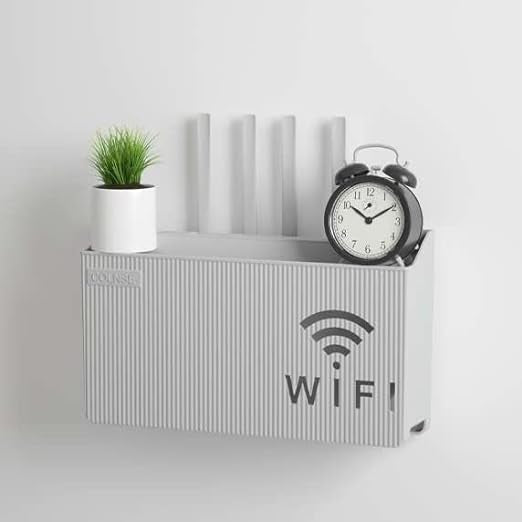 Wall-mounted WiFi router shelf in pink, holding router and cables.